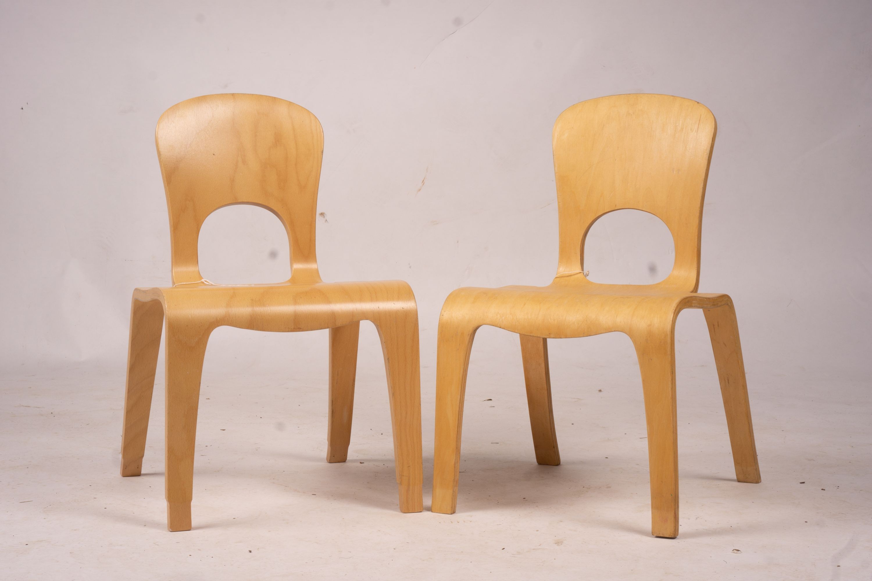 A pair of ‘Comunity’ ergonomic design children’s chairs, 55cm high max.